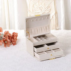 Boîte à bijoux en cuir PU à 3 couches avec 2 tiroirs et plateau amovible, Rose clair / Blanc
